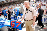 Minutes before the race, Dad poses with Sarah Fisher's car...and is actually touching it!  YIKES!